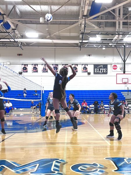 Lady Broncos Varsity Volleyball defends their court with a strong spike!