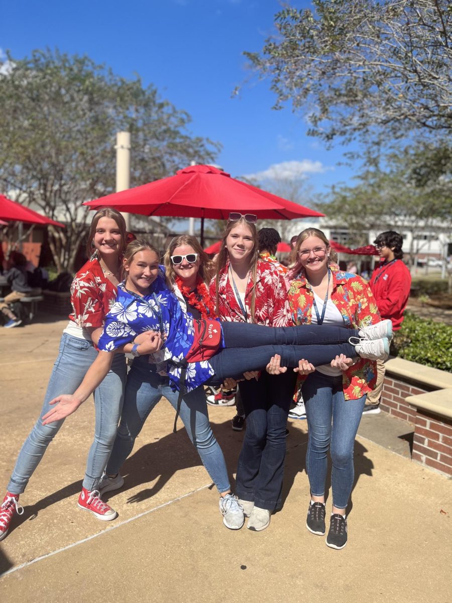 Decked out in the perfect beach attire, Emma White (9), Rylee Bozeman (11), Elizabeth Hughes (9), Landrie Barr (11), and Emily Wedblad (10) happily show off their Hawaiian attire! 