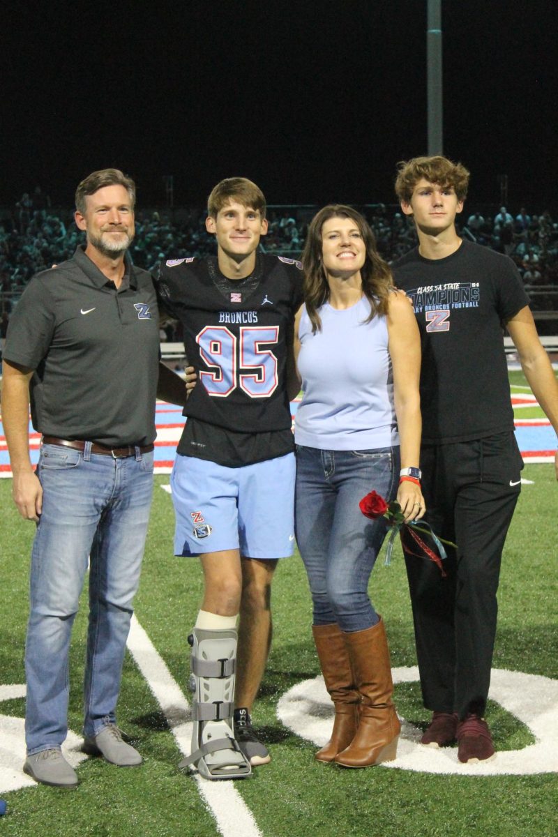 Kellen Conachen (12) is recognized as the kicker for the Varsity football team!