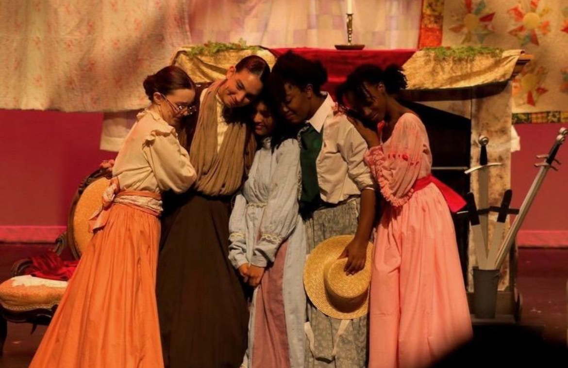 Cast A

(From left to right) 
Kenzie Robinson (12) as Meg March, Lillie Derouen (11) as Marmee, Megan Beck (12) as Beth March, Andrea Condol (12) as Jo March, and Mackenzie Brown as Amy March all share a loving embrace comforting one another during the stressful times they live in.