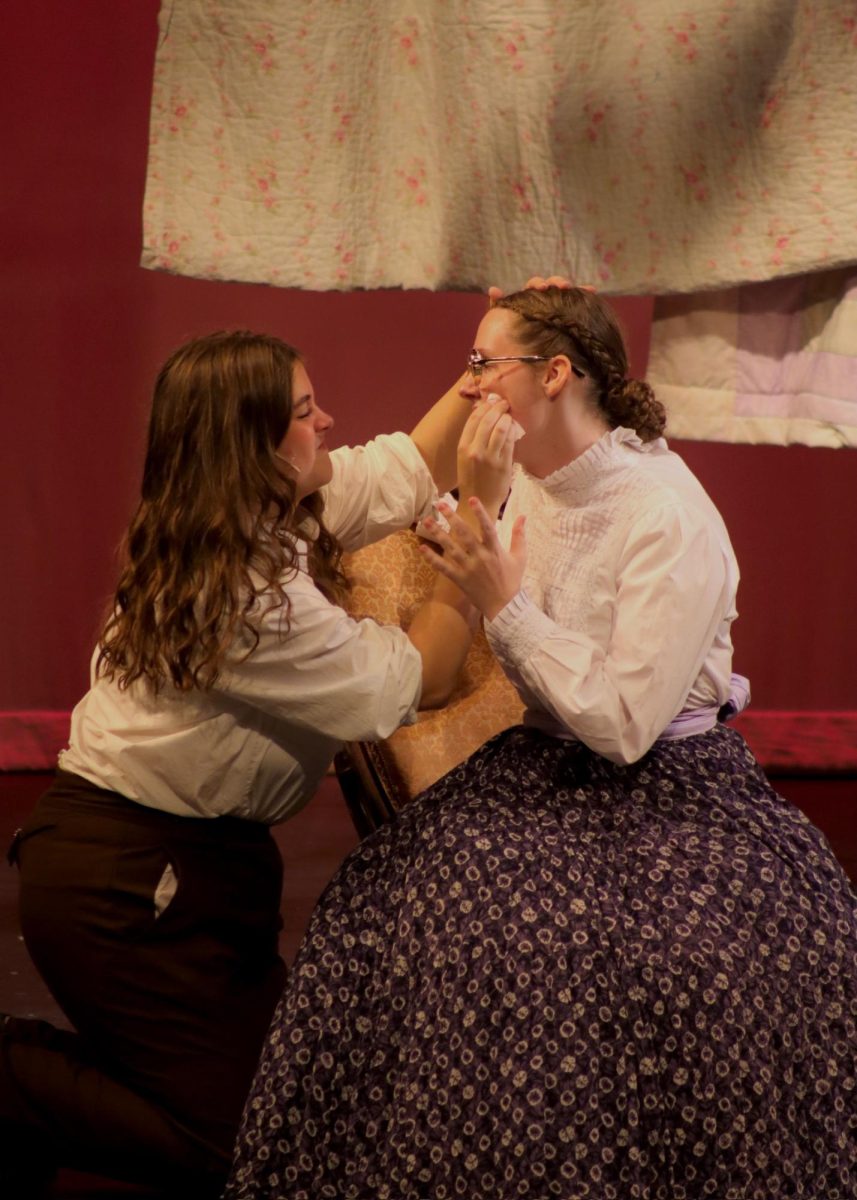 (Left) Magnolia Charlet (12) as Jo March, consoles (Right) Katie McCrary (11), as she stresses about the trials of motherhood.