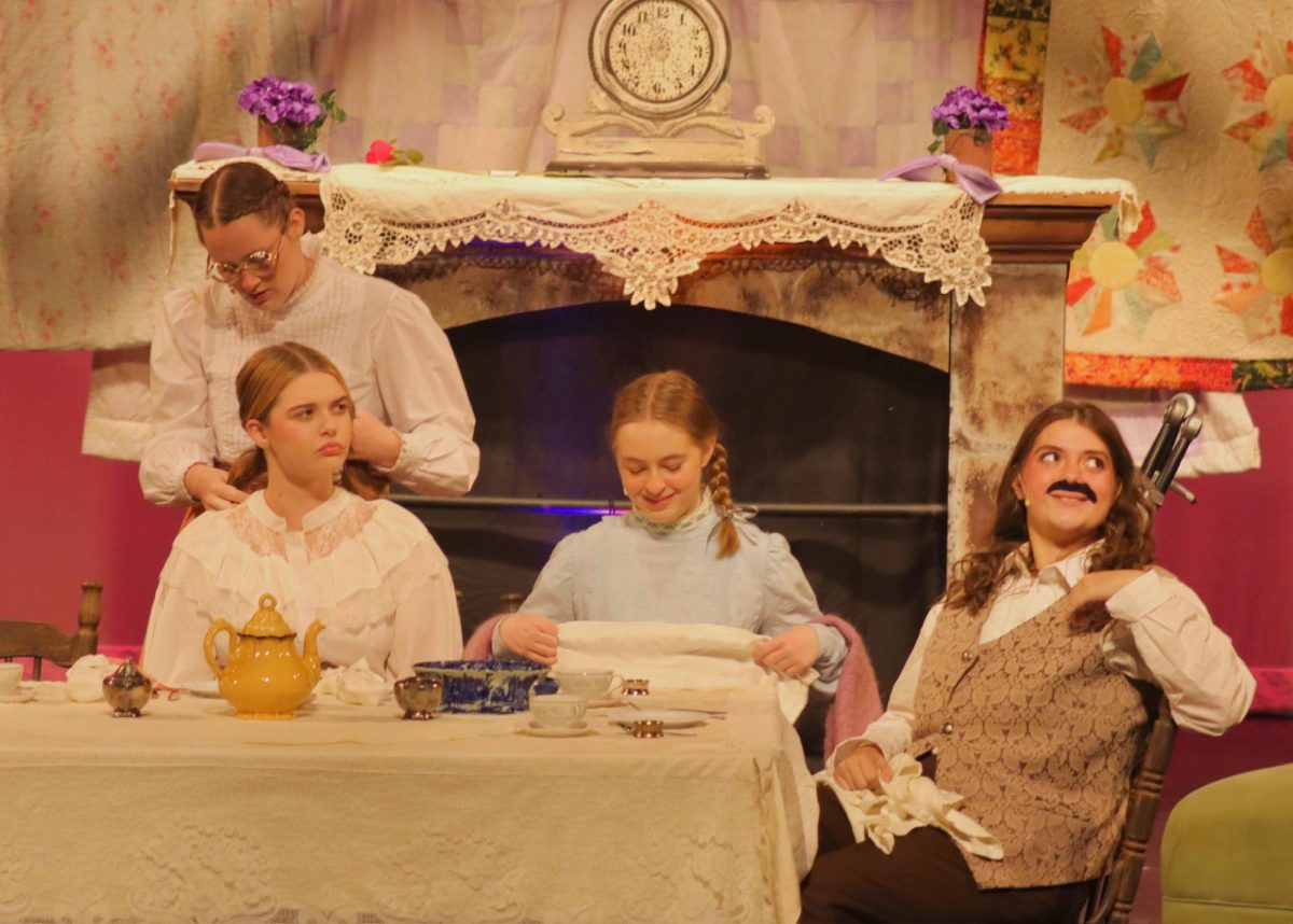 Cast B

(From left to right) Katie McCrary (11) as Meg March, Ella Lloyd (10) as Amy March, Chloe Delee (11) as Beth March, and Magnolia Charlet (12) as Jo March, sit down to eat dinner as each sister shows their personality.