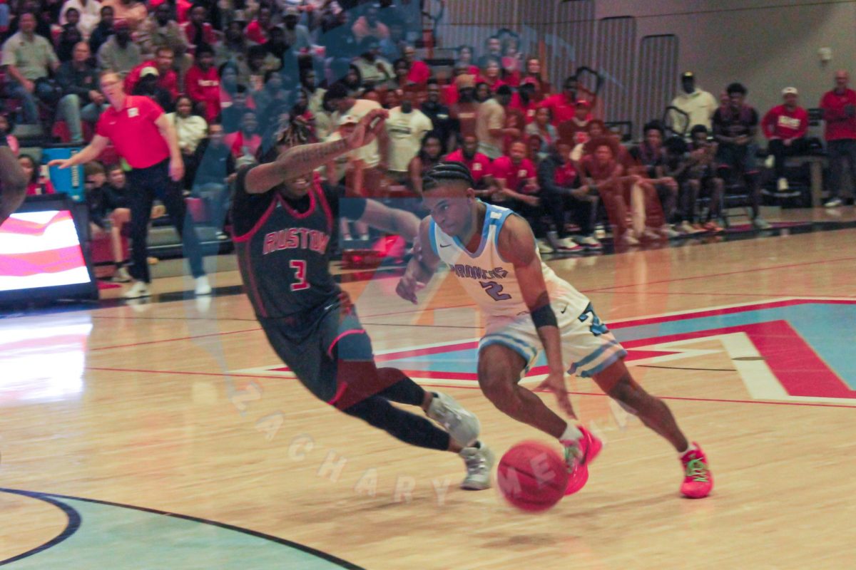 Kheiri Haynes (12) tramples past Ruston in attempt to make a shot.