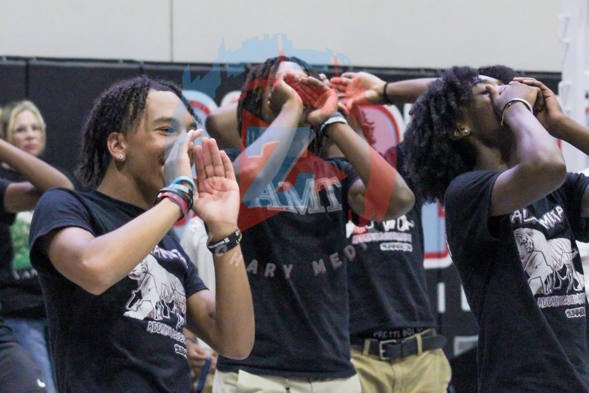 A group of students gets ready before they go and perform to the mass students at the pep rally. The groups excellent display of choreography wowed the students in attendance. 