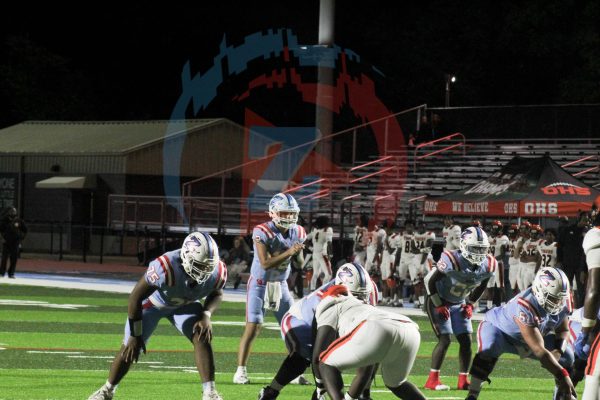 Caleb Gonzalez (12) gets in a shotgun formation about to take the snap. Gonzalez's leadership on and off the field proved key to the Broncos win.