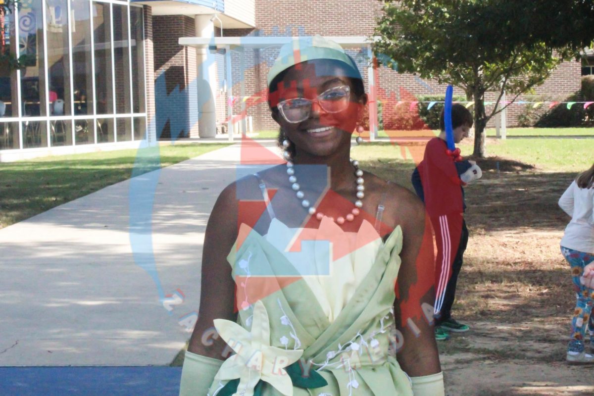 J'Aire Clark (10) dresses up as the Disney princess Tiana for the children.  