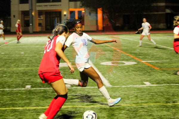 Yasim Batchelor (12) stops an SJA attack from the wing. Batchelor's defensive efforts were one of the many reasons the Broncos were successful in the first half.