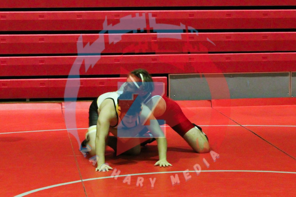 Oliver Shoaf (10) putting in strength to tackle and pin his opponent.