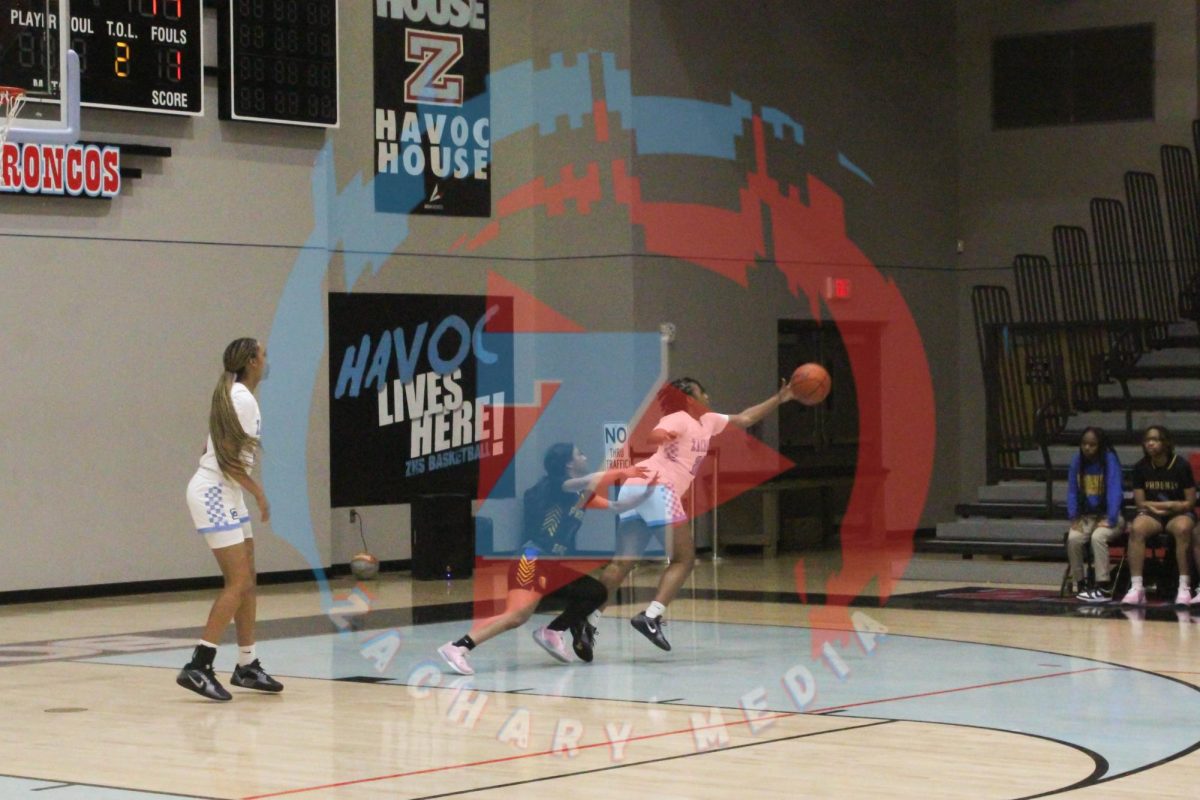 Latavia Duncan (12) tries to get the ball after bouncing back off the basket.