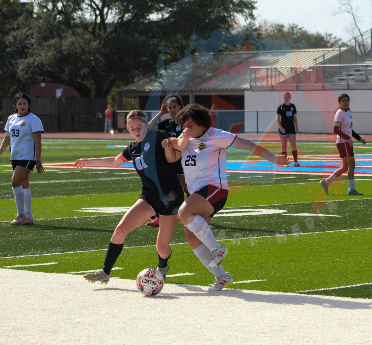 Melissa Nolan (12) makes a great tackle from a NOMMA defender. Nolan and the rest of the midfield played great defense, recording a clean sheet.