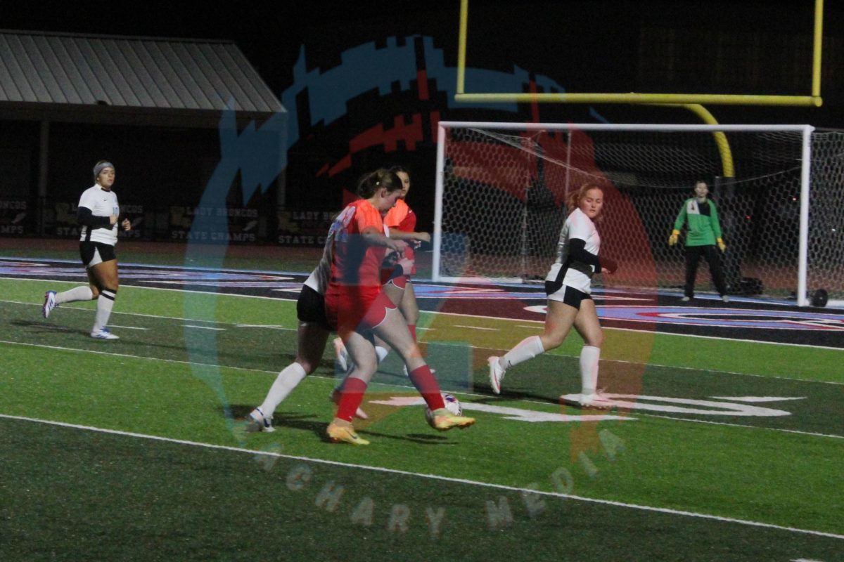 Sophia Herbert (10) kicks the ball to her teammate.