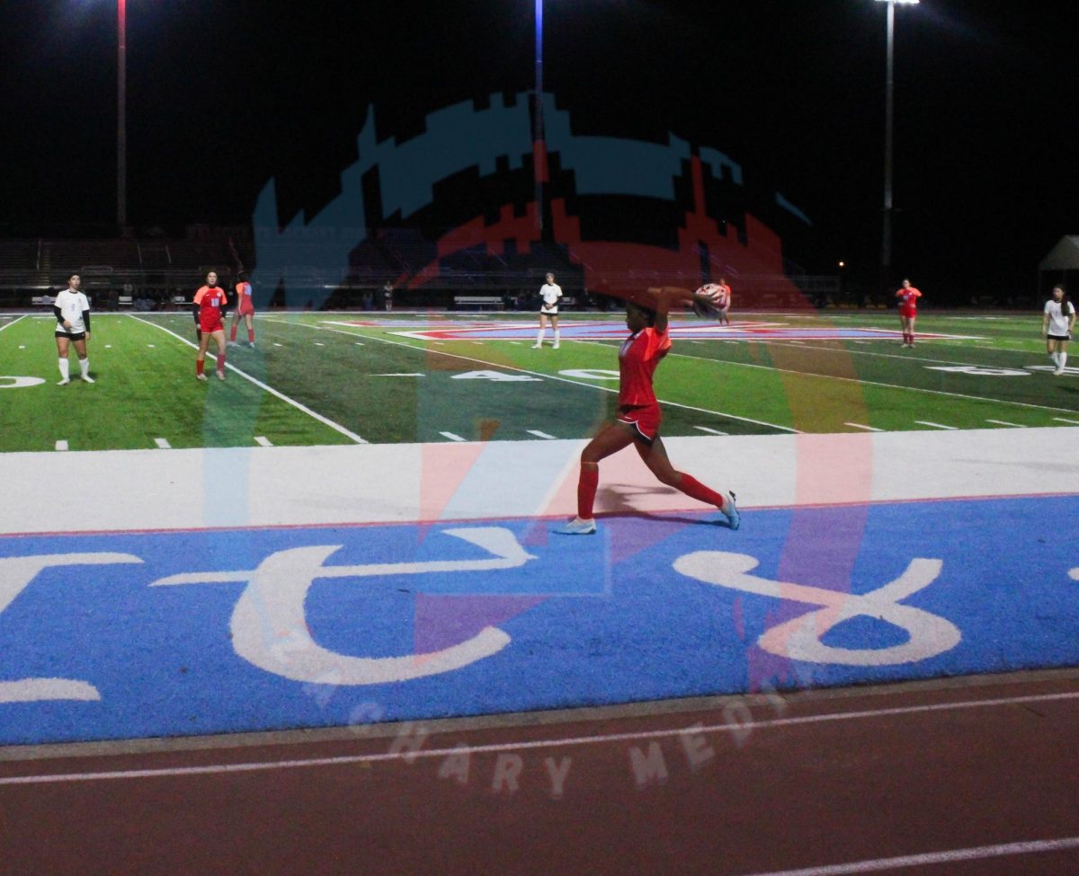 Yasmin Batchelor (12) throws the ball back in the flied. 