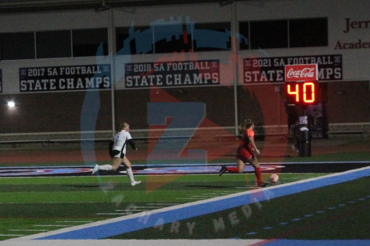 Trinity Spence (11) chases after the ball.