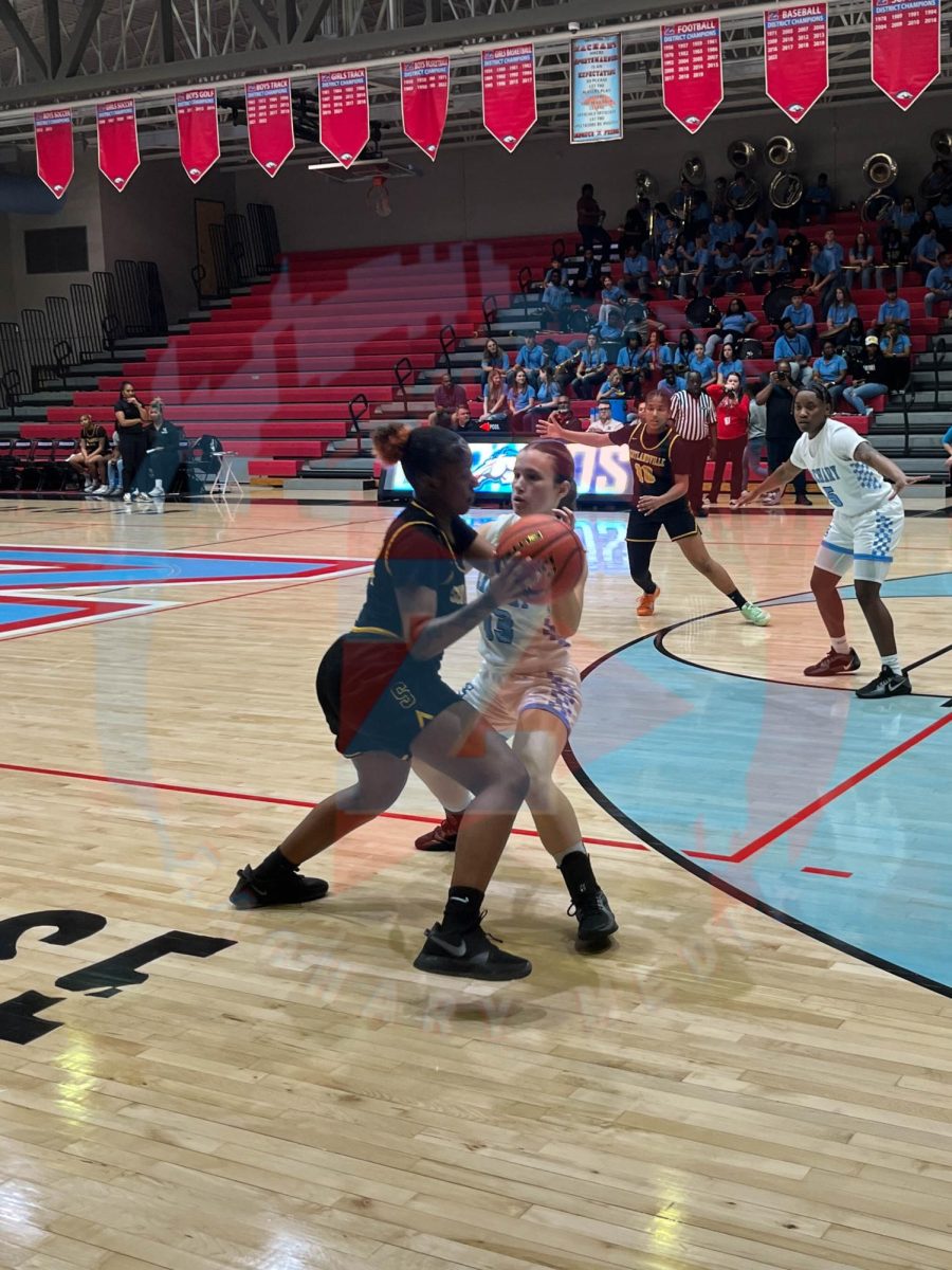 Reese Quibodeaux (12) Blocking the opponent form passing the ball to team.