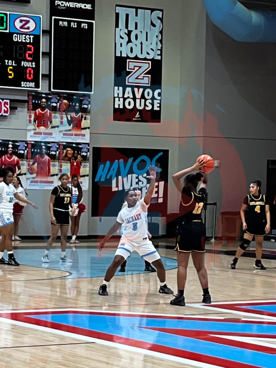 Kaitlyn Blake (12) stopping the opponent from passing the ball. 