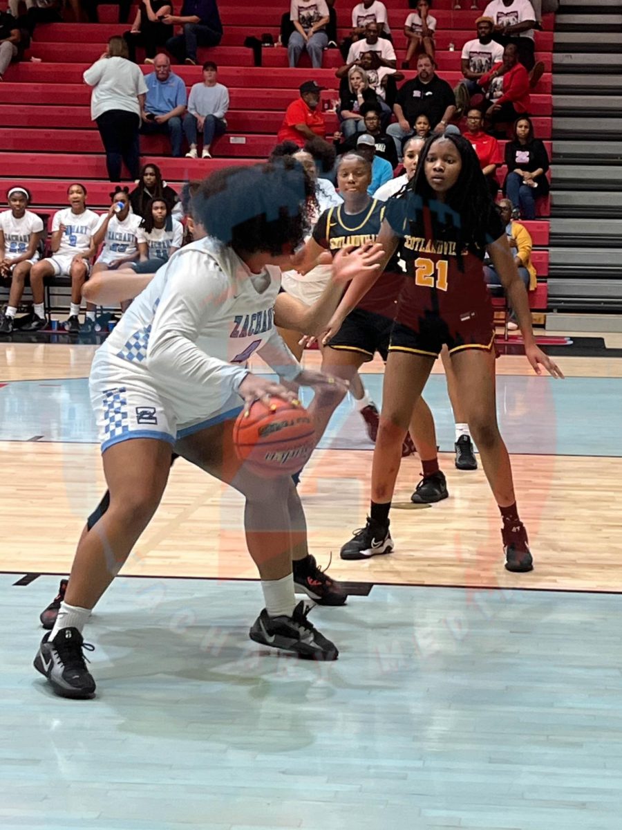 Madison Alcerro (12) blocking the opponent form getting the ball.