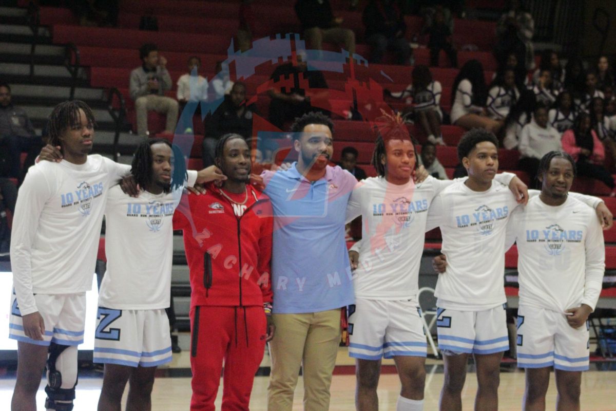 Seniors on the Bronco's basketball team stand with Coach Jonathan McClinton after their senior presentation. 