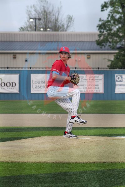 Jack Prejean (12) winds up to deliver a pitch from the mound. 