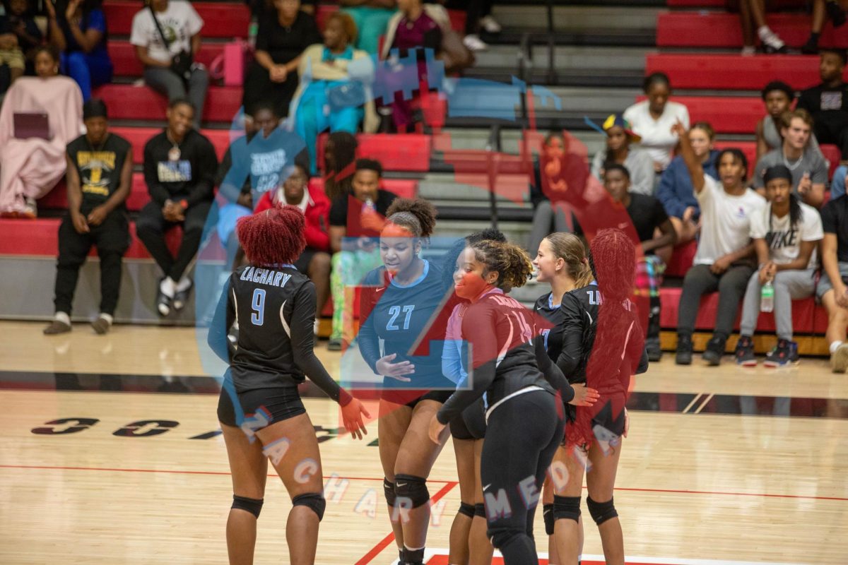Zachary Broncos celebrate after getting point.