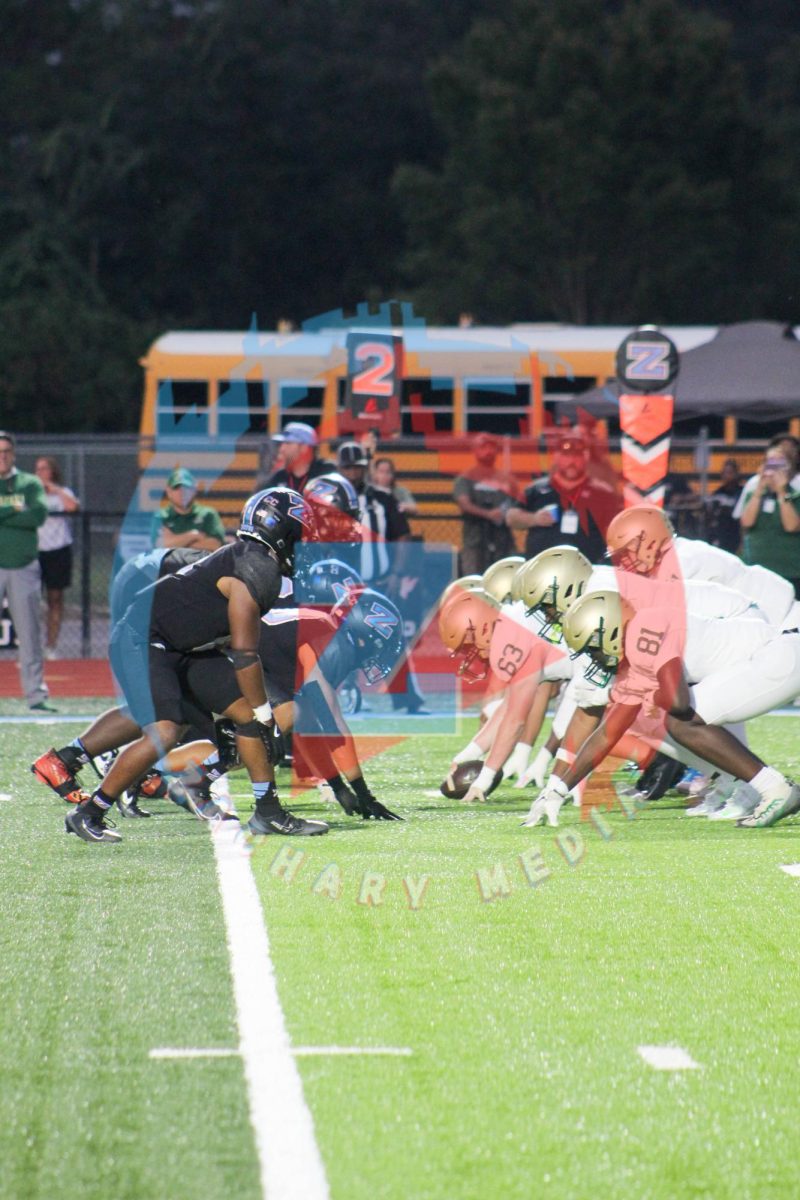 The ZHS Defensive line squares up against the AHS Offensive line.