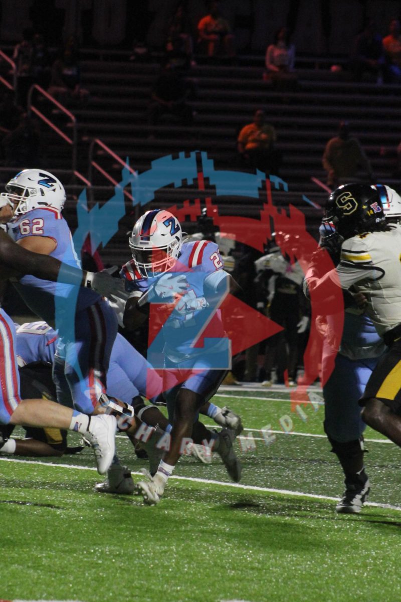 Jeremey Patton (12) keeps the ball breaking the line of scrimmage in the Bronco red zone.