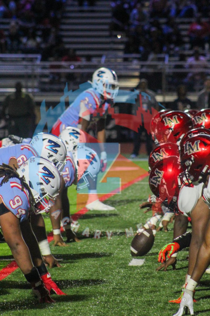 The ZHS defensive line squares up against the LMHS offensive line before the snap. 