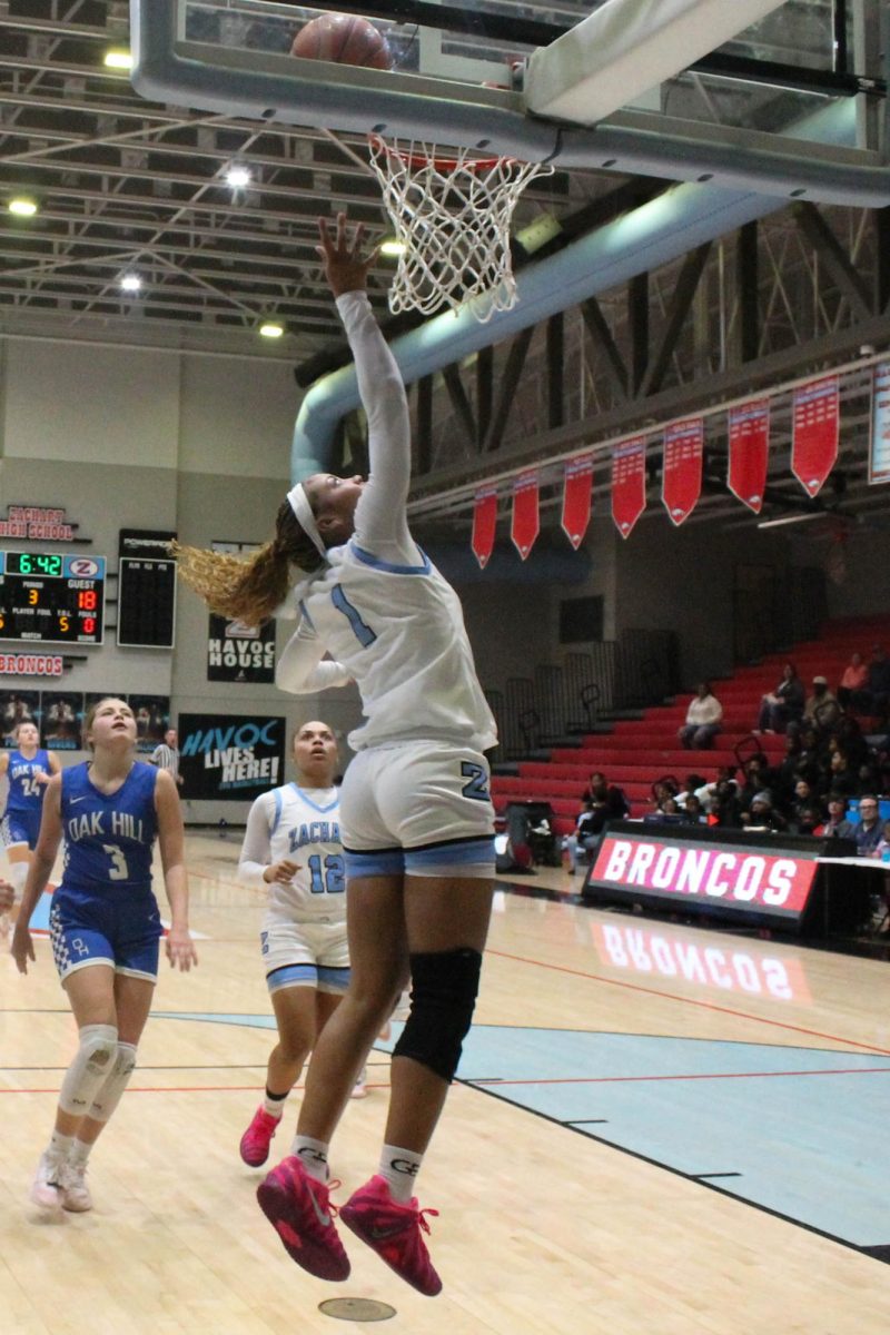 Ava Raymond (12) doing a lay-up that gave the Lady Broncos another point.