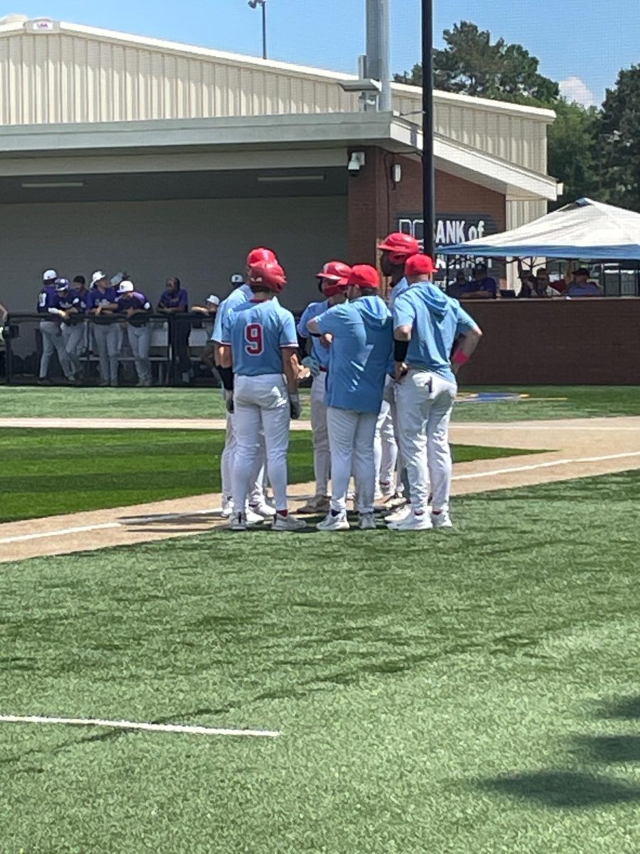 Broncos take a huddle during their semi final game. 